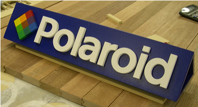 large image of polaroid sign